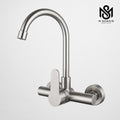 Wall-mounted matte steel kitchen mixer tap with high-arc gooseneck spout for modern sink installations.