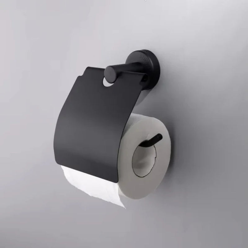 Matte black toilet paper holder with a protective cover mounted on a white background, displaying a single roll of toilet paper.